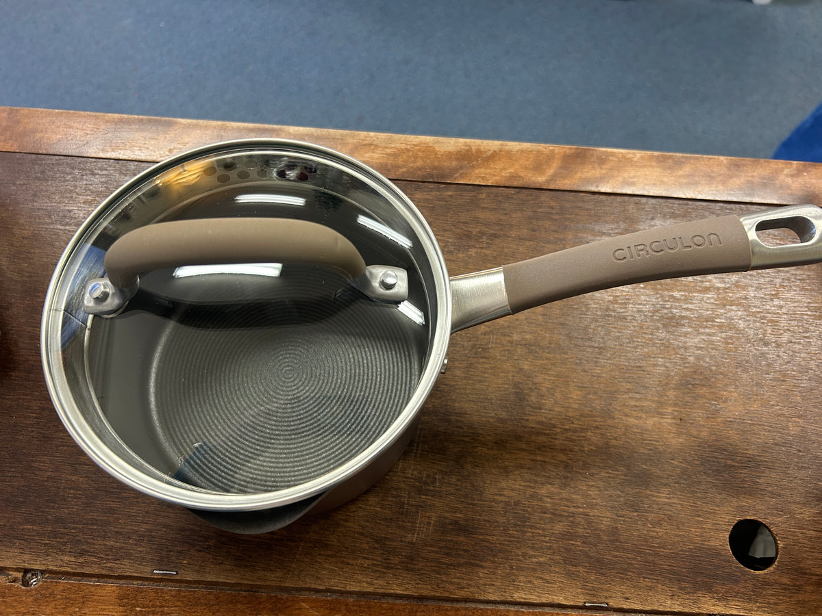 Circulon sauce pan with lid, interior view and circular brushed base