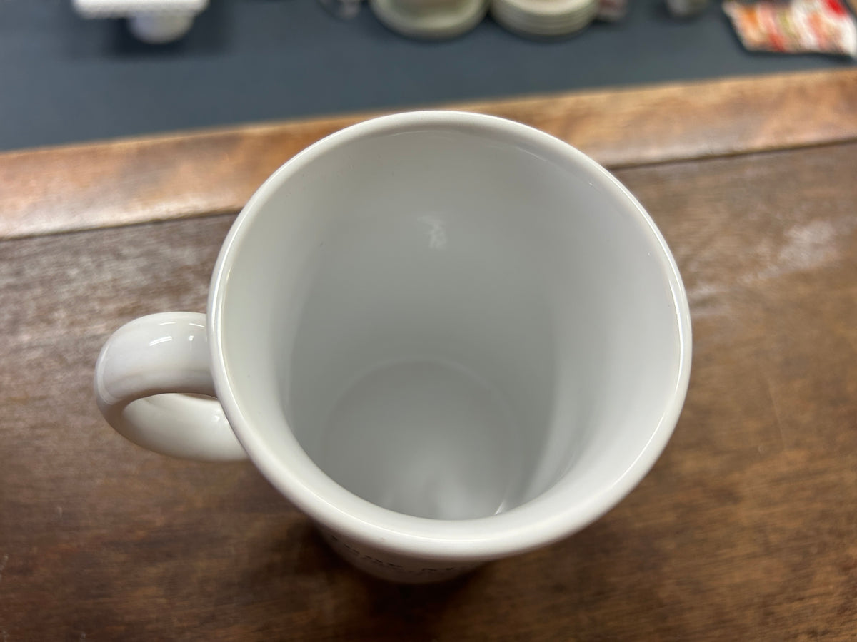 White ceramic mug interior with smooth rim and side handle