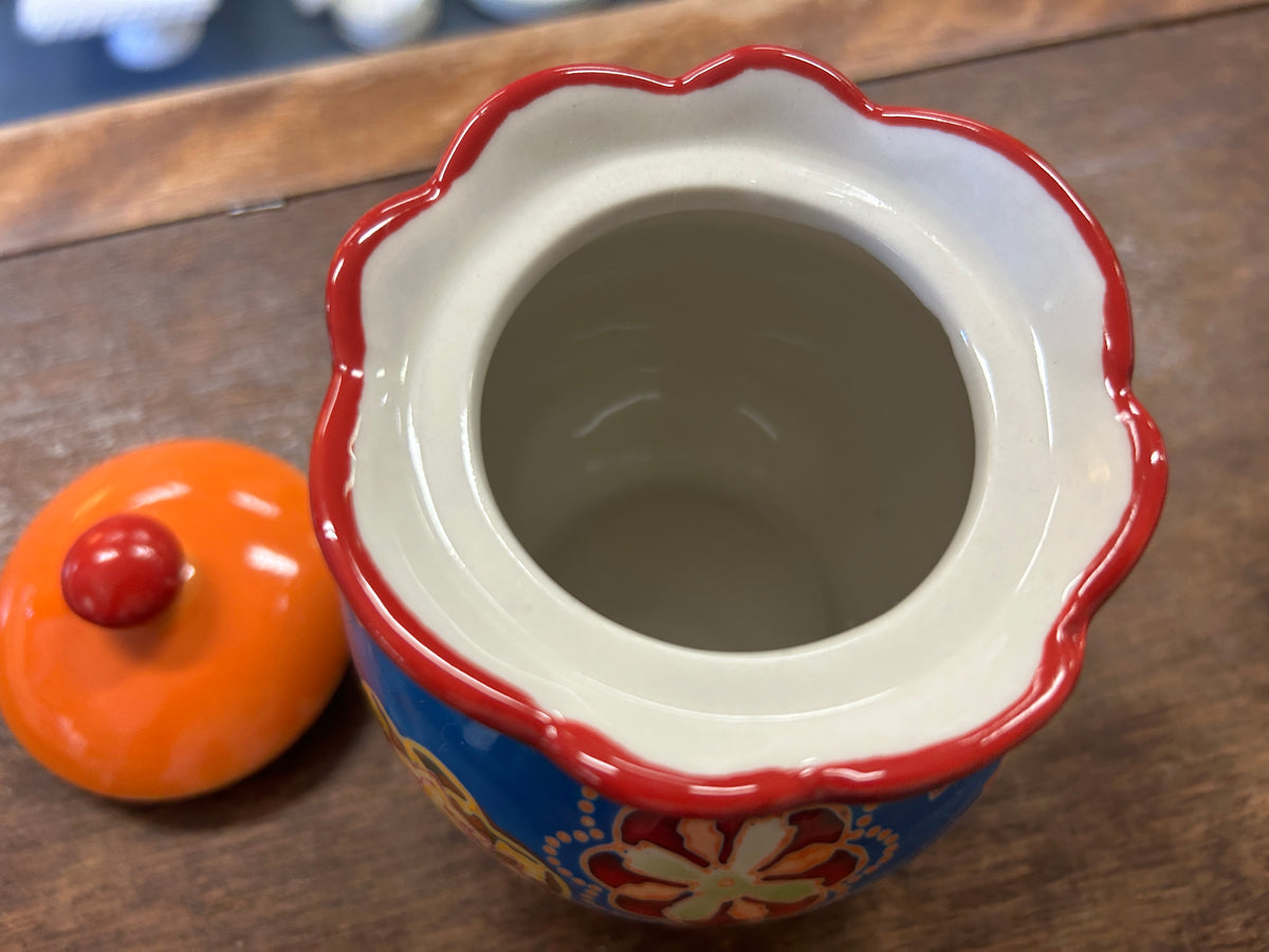 Ceramic sugar bowl interior opening with white rim and multicolor blue body