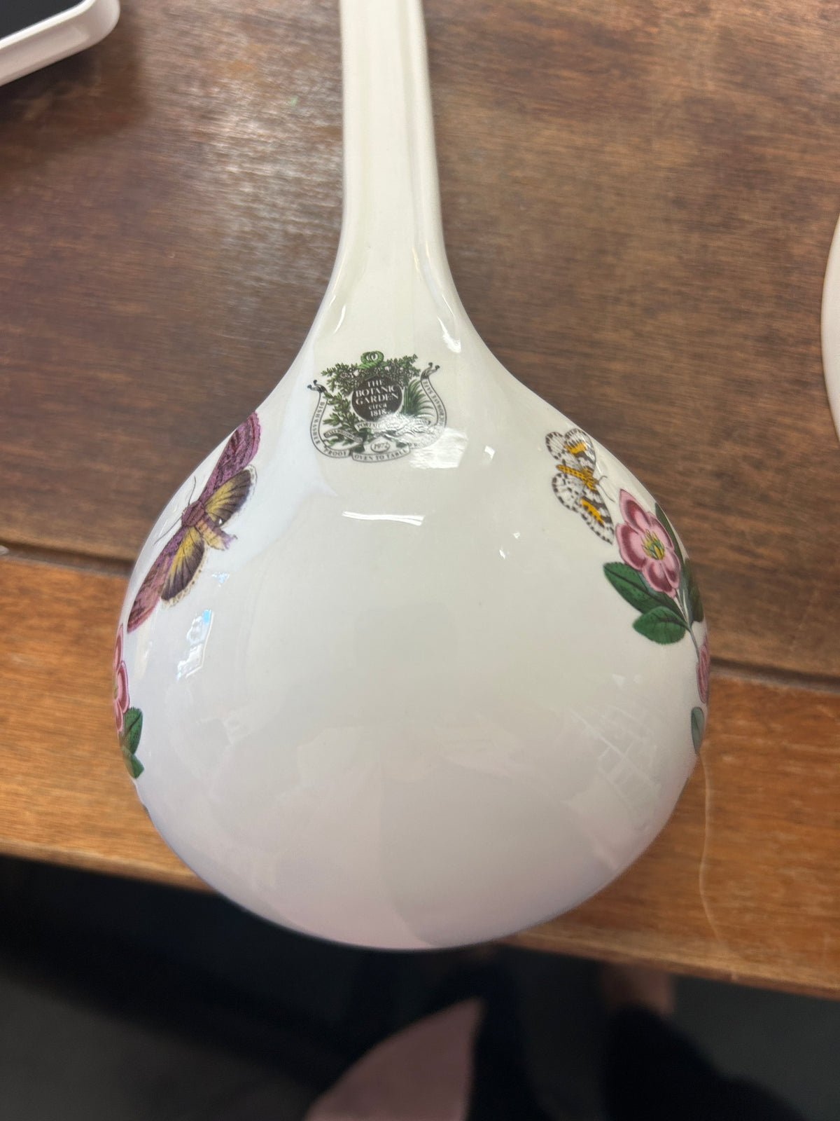 Botanic Garden ceramic ladle with curved bowl and small floral insect design
