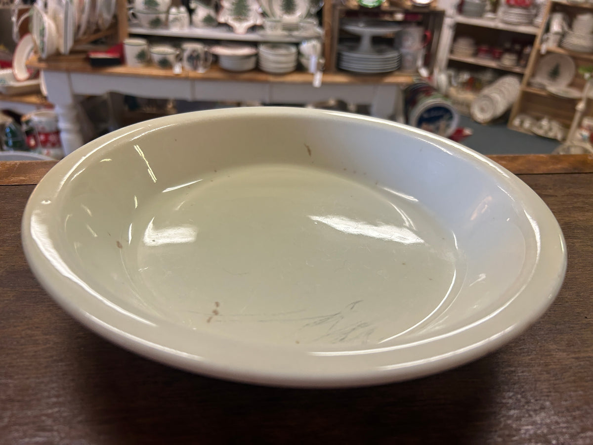 White ceramic pie plate interior, shallow dish shape