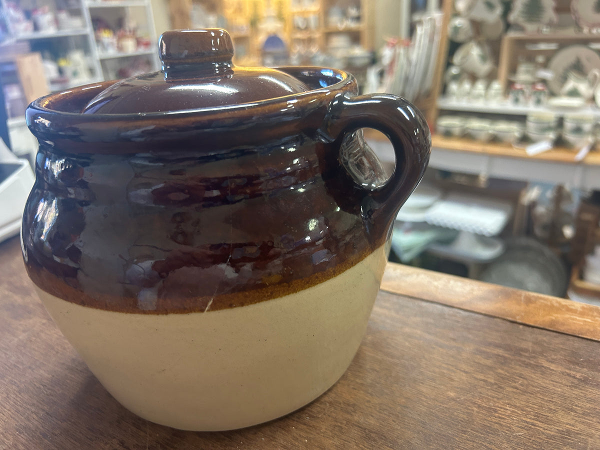 Bean pot side view showing one loop handle and a glossy brown upper glaze