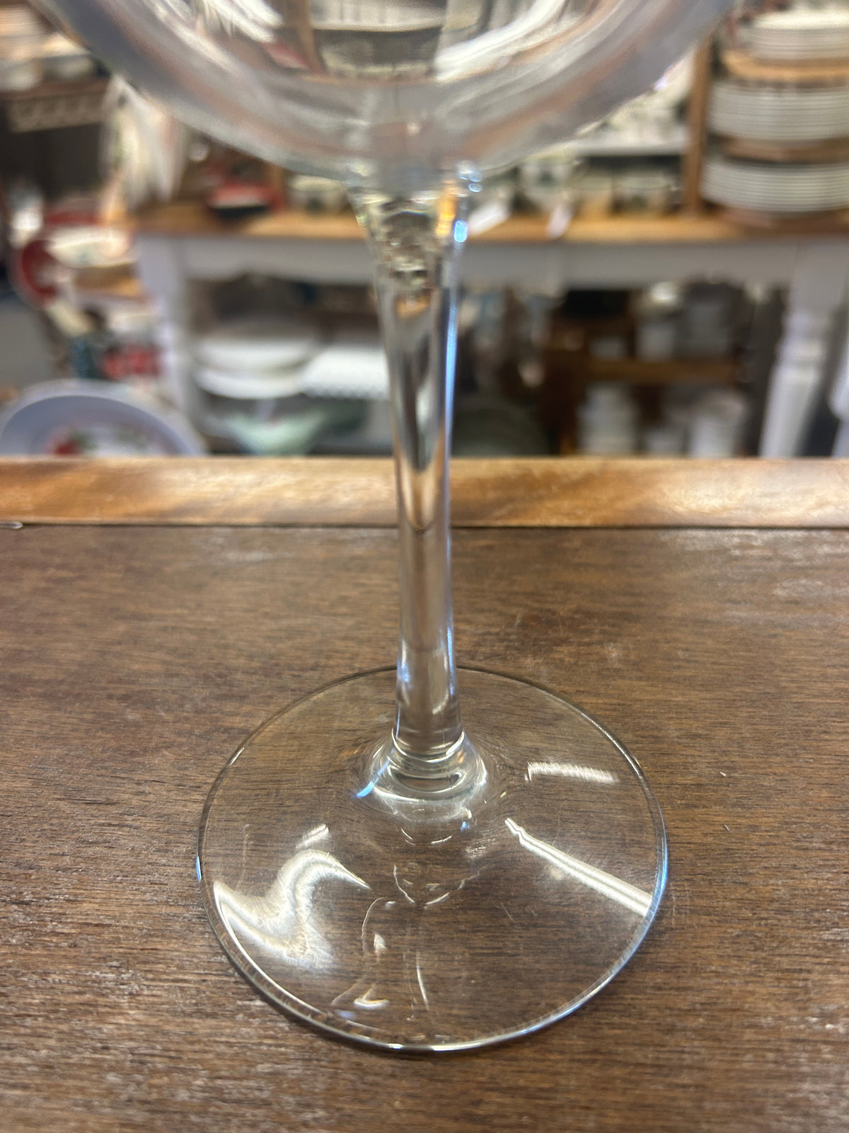 Clear wine glass showing its slender stem and round foot