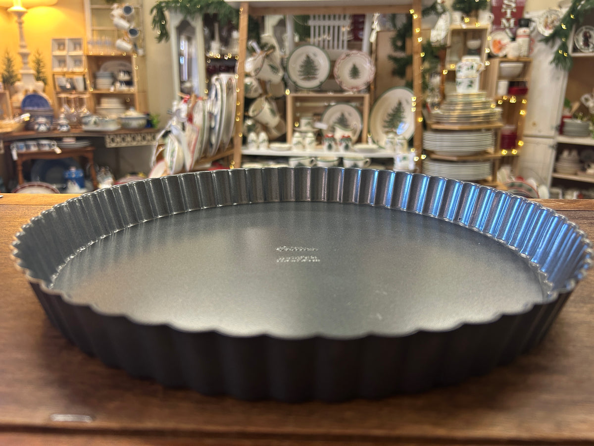 Silver Wilton 11-inch tart pan with removable bottom and fluted sides