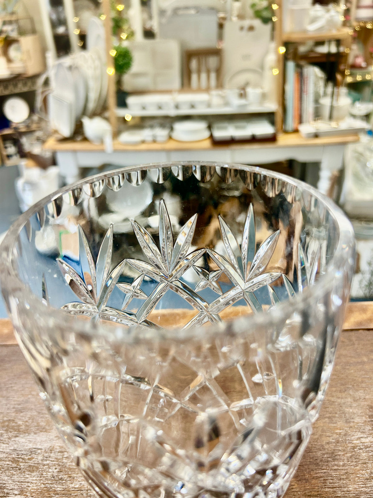Clear glass pineapple-cut vase with detailed fluted rim and pointed facet pattern