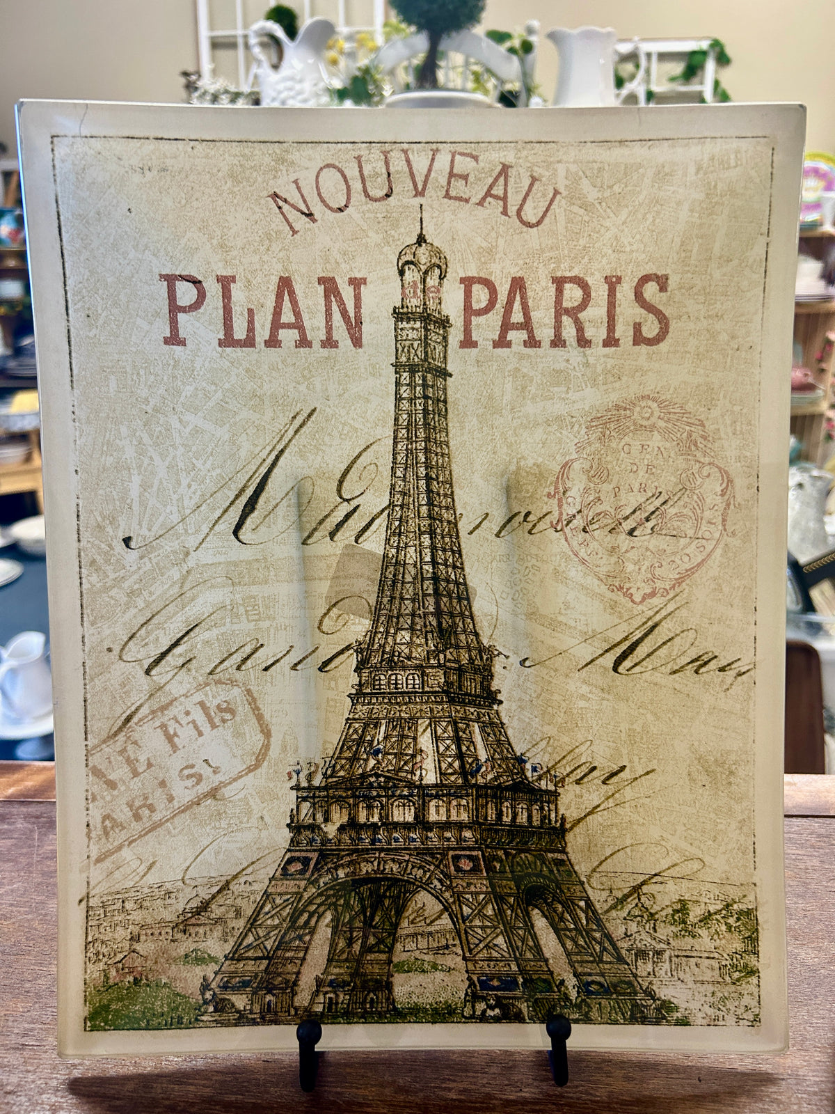 Black and white glass platter with Eiffel Tower illustration and 'PLAN PARIS' text