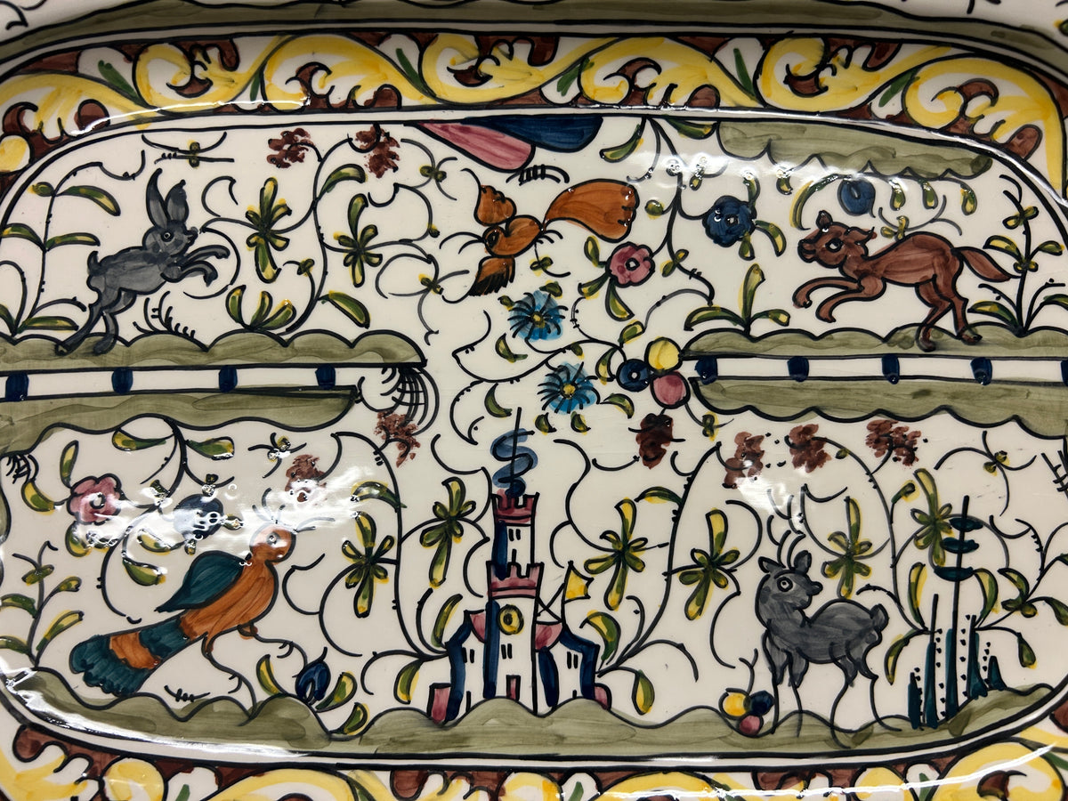 Multicolor ceramic oval platter with countryside animals, plants, and village design