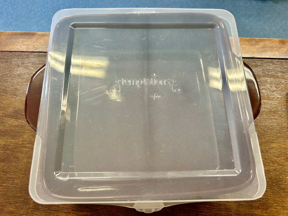 Clear square plastic lid with matching square tray opening and molded edges