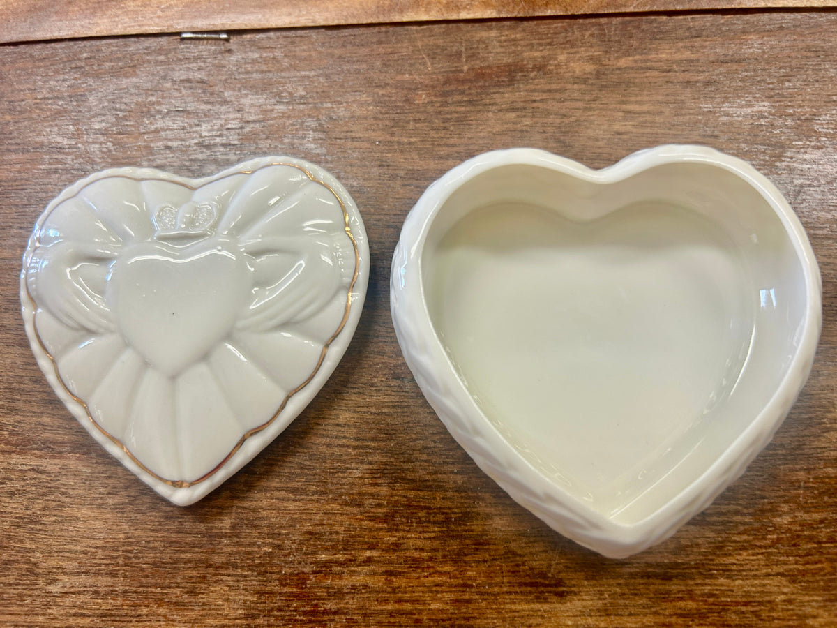 Heart-shaped ceramic plate, front and back views, glazed white