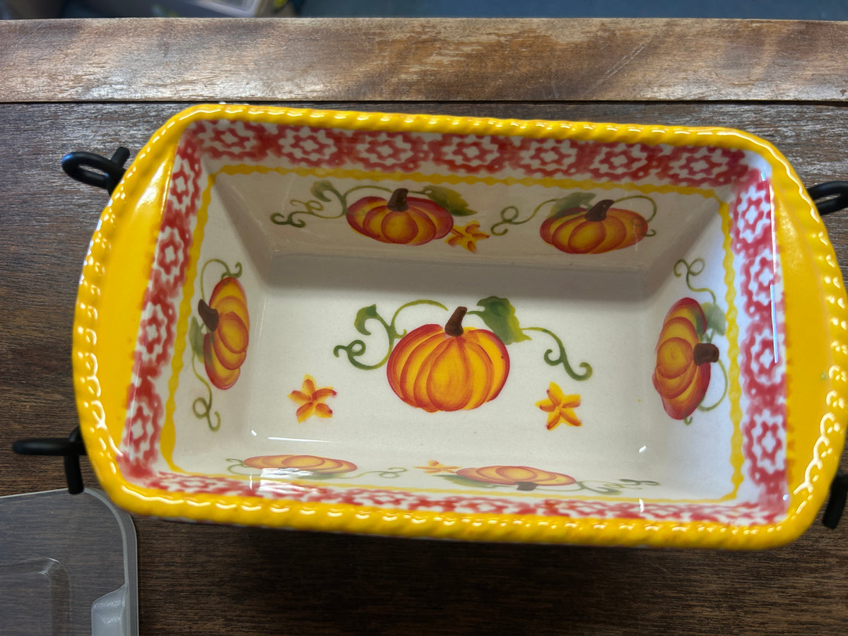 Pumpkin baker dish interior with yellow edge, orange pumpkins and floral accents