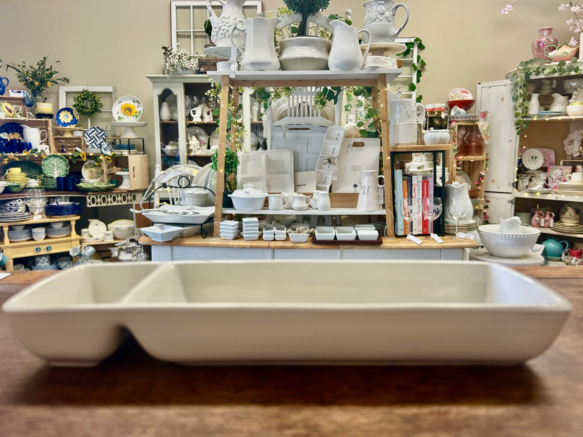 White rectangular ceramic bowl with raised end compartments and shallow center