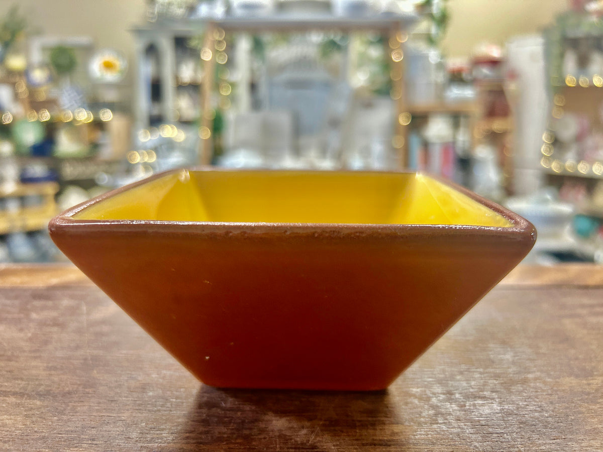 Square ceramic bowl with yellow interior and orange glazed exterior, 5 in.