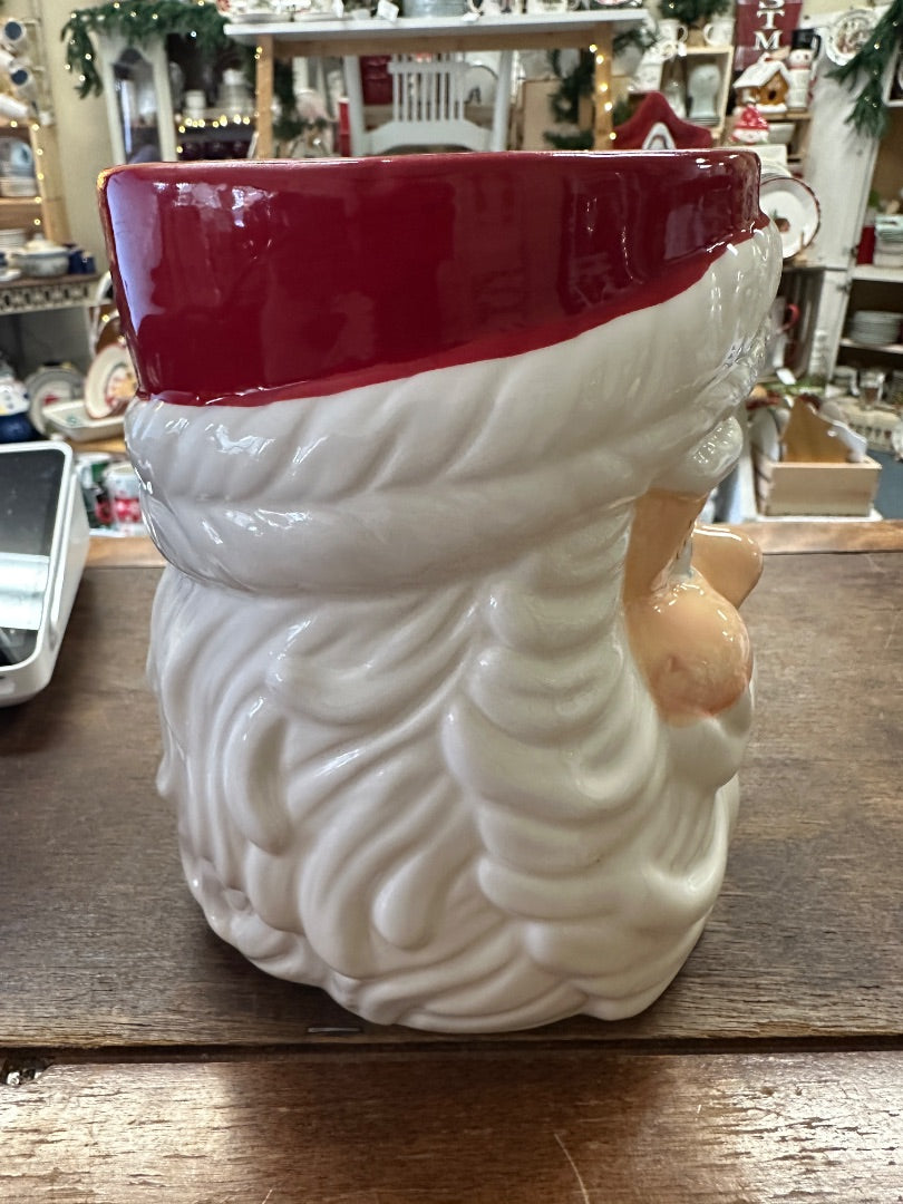 Red and white Santa utensil crock mug, front side view with raised head