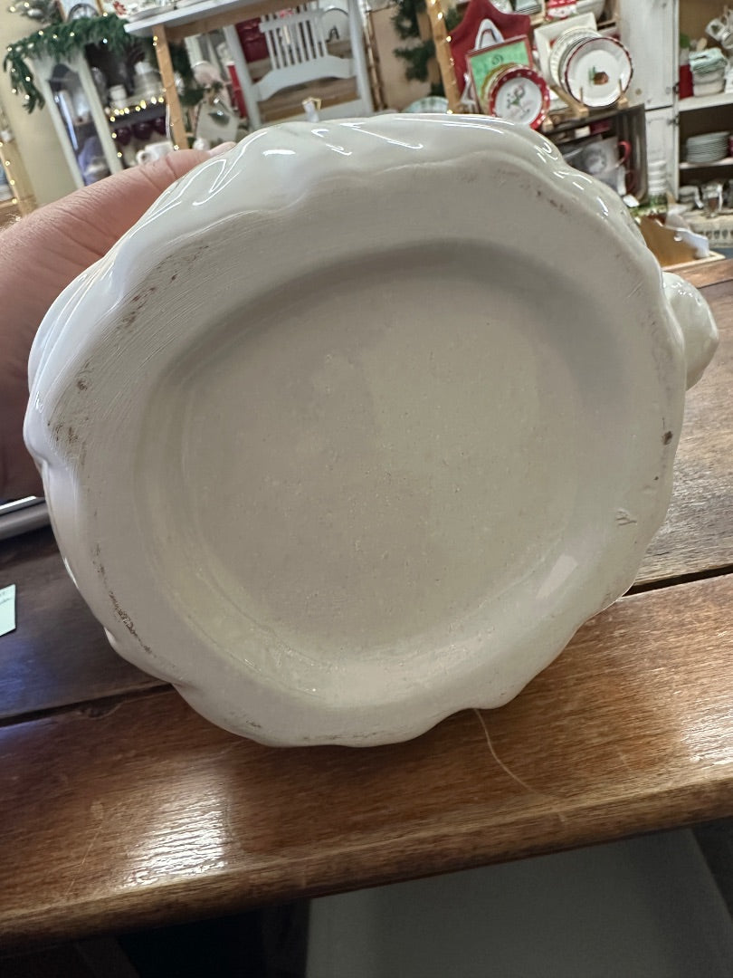 Bottom of red and white Santa utensil crock mug, glazed ceramic base