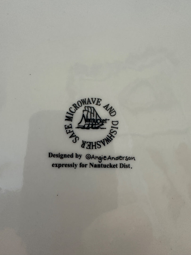 White ceramic plate back with McCrowave Nantucket Dist. logo and design credit