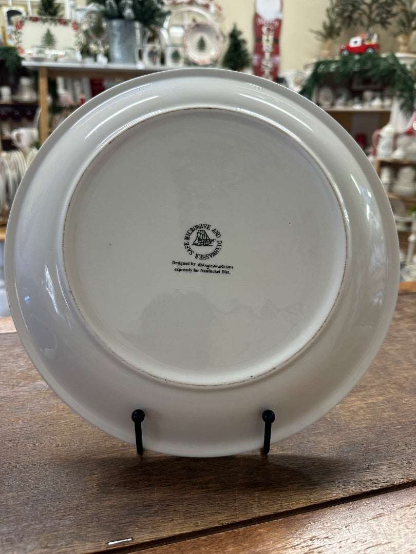 White ceramic decorative Christmas plate, back side with brand stamp and hanging tabs