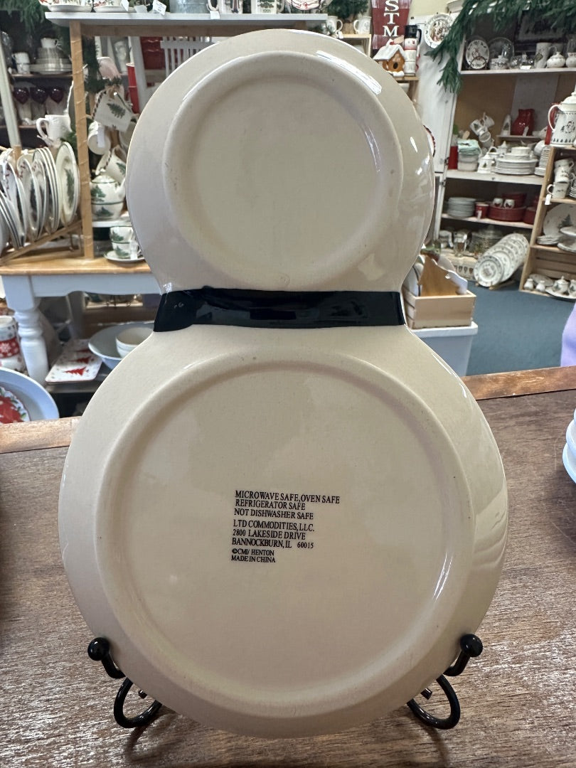 Snowman decorative plate set, back view with small care label text, round ceramic