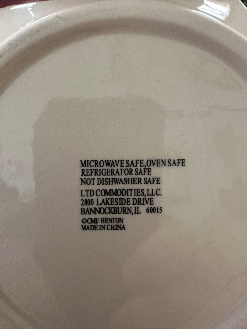 Ceramic plate underside with microwave-safe oven-safe label