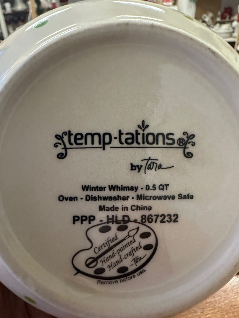 Bottom of ceramic bowl with Temptations by Tara logo and oven-safe and Made in China text