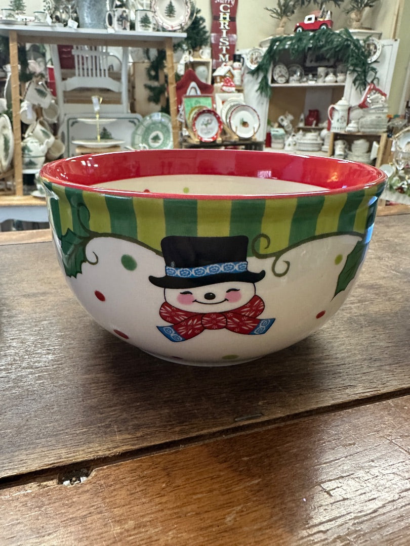Santa nutcracker ceramic bowl with red rim, green stripes, and winter character