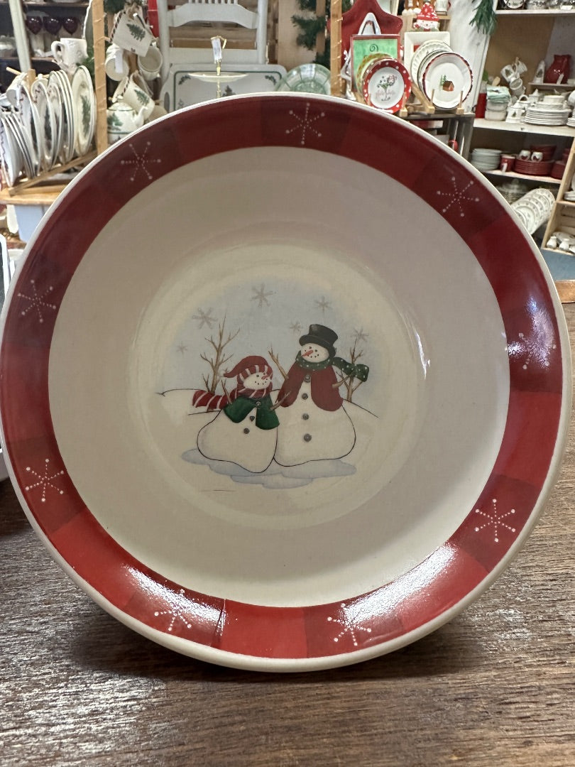 Decorative red-rim ceramic bowl with white interior and snowman couple graphic