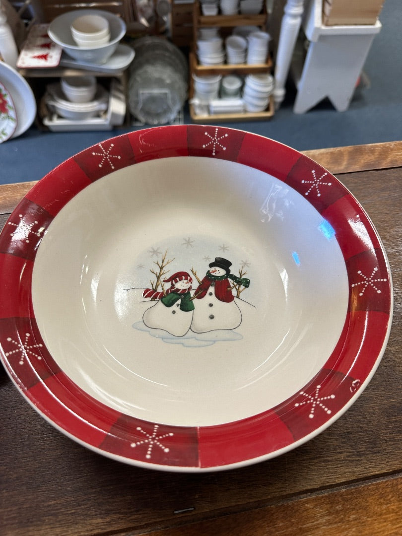 Red holiday serving bowl with snowman center design and red star rim
