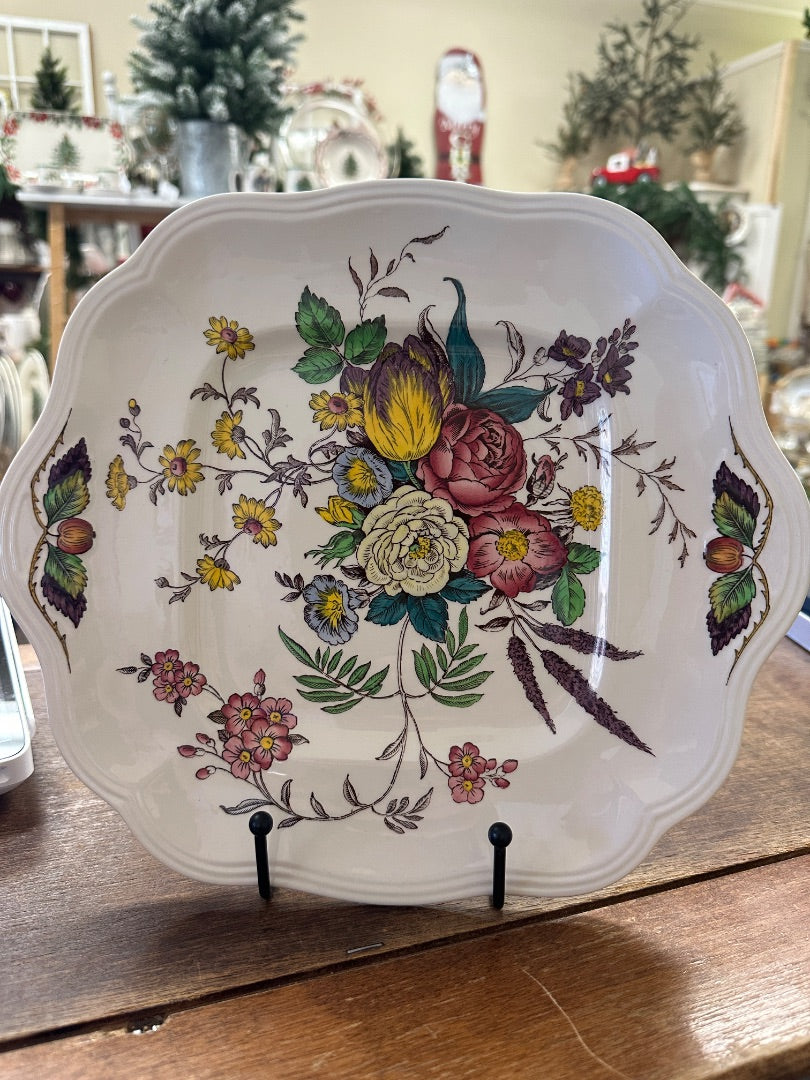 Decorative floral and bird ceramic platter with scalloped edge and raised frame