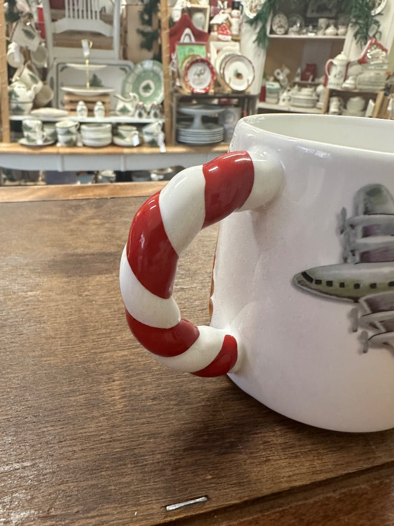 White Christmas mug with airplane print and candy-cane handle, side