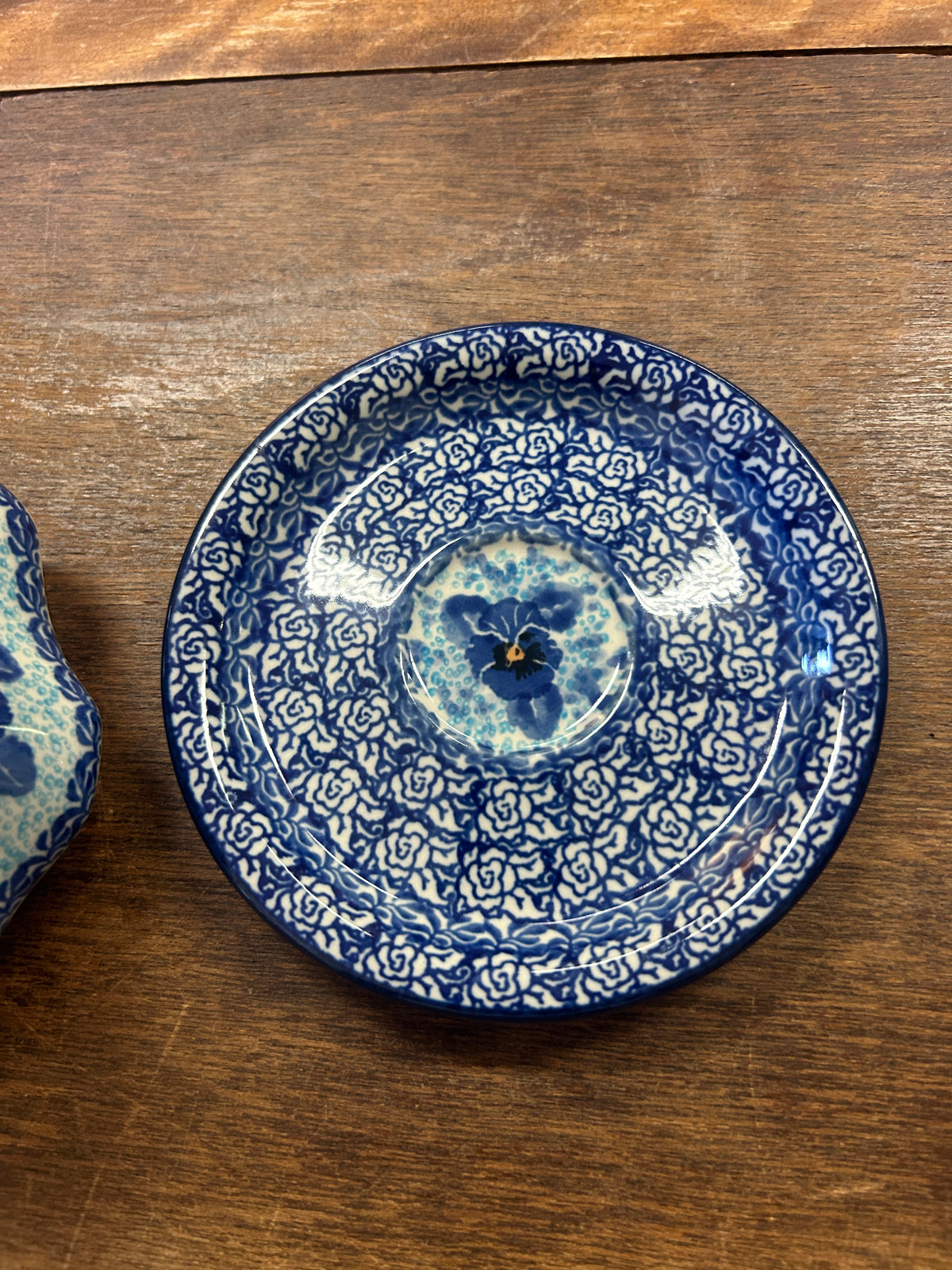 Matching blue ceramic plate with circular patterned center dish