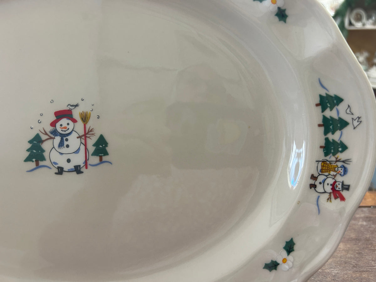 Ceramic oval serving platter with snowman artwork and small tree-and-star accents
