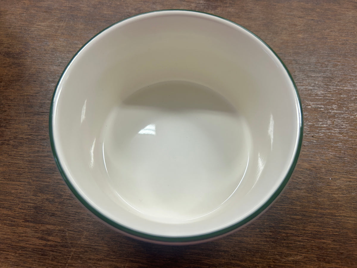 White ceramic bowl interior with glossy finish and green rim