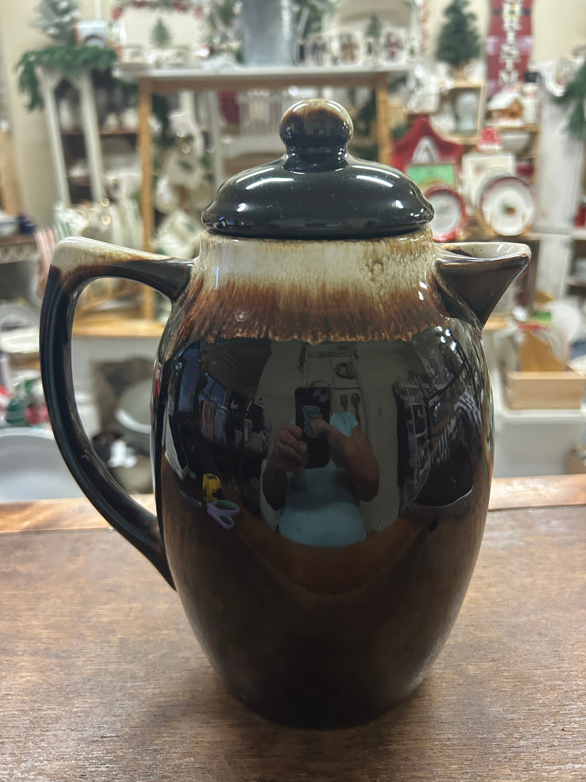 Brown ceramic drip coffee pot with dark teal lid, symmetrical side handles