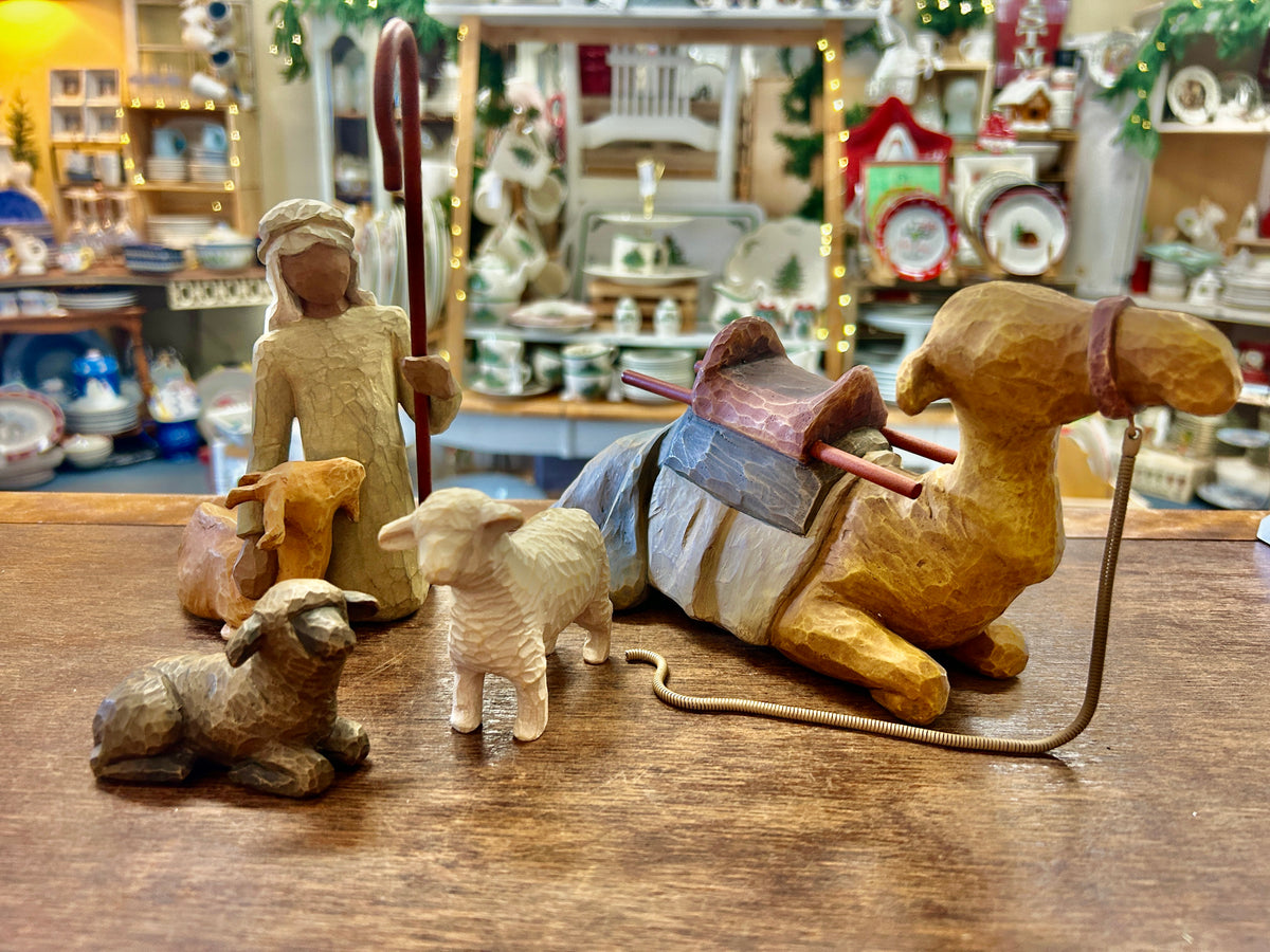 Cream shepherd figurine with staff and three stable animal figures, 4-piece set