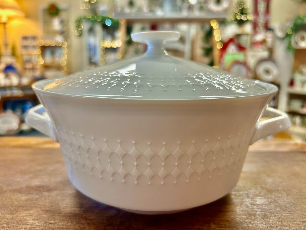 White diamond-pattern casserole dish with domed lid and side handles