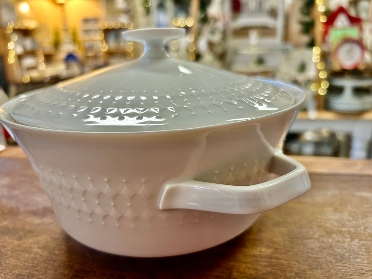 White diamond-pattern casserole dish with domed lid and one side handle
