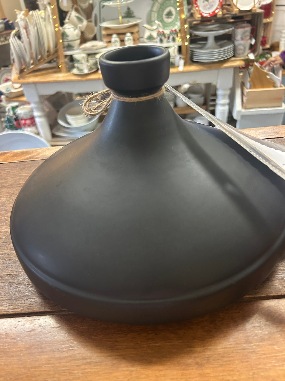 Dark gray tagine base with wooden base stand