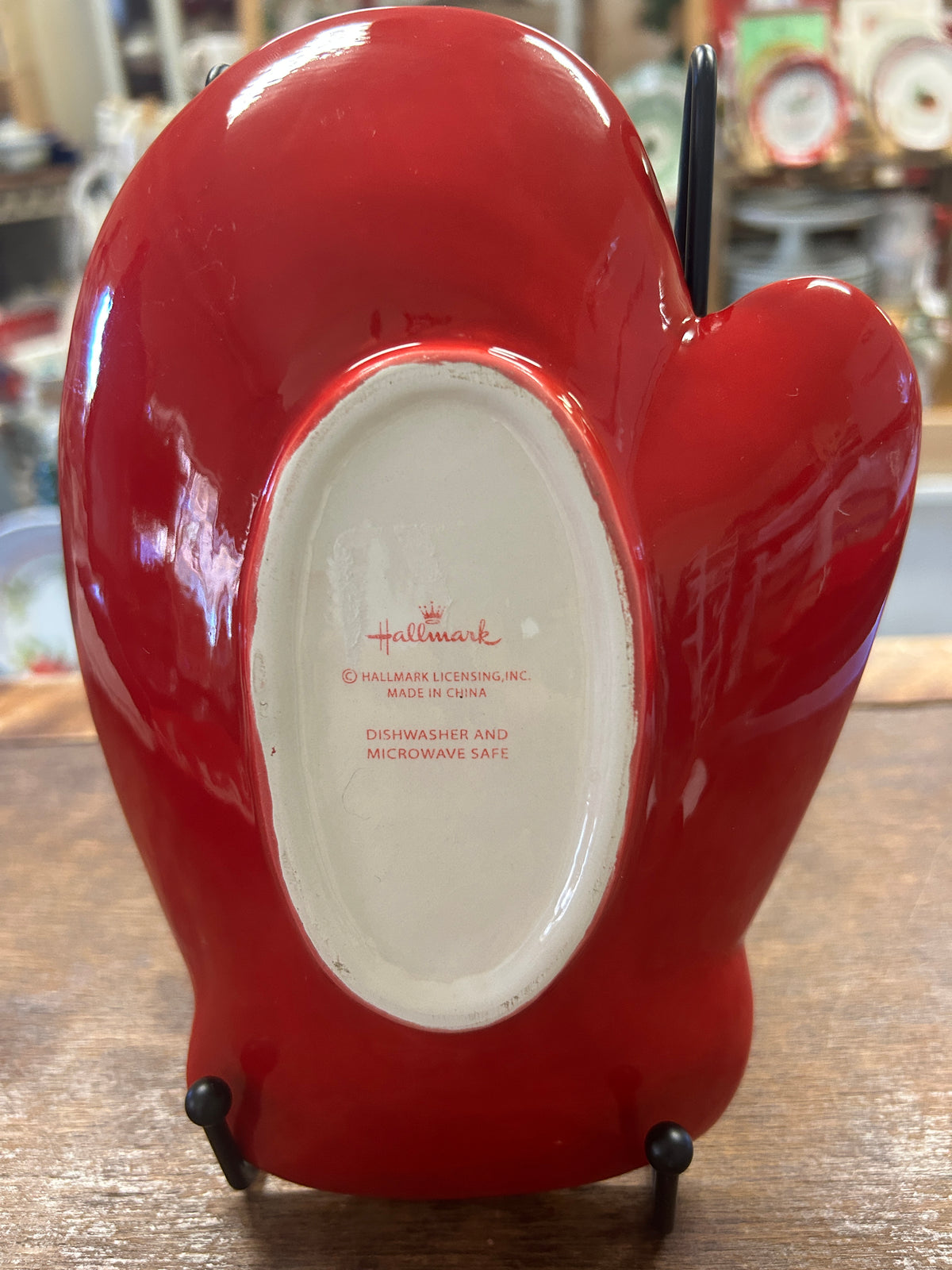 Red ceramic mitten plate back with white oval label and Hallmark markings