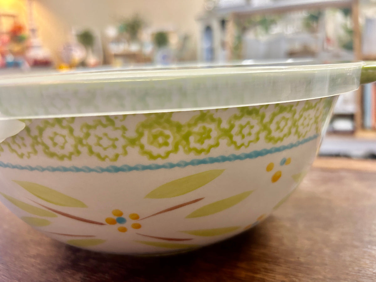 Temptations Old World 3-qt green bowl with clear lid, floral detailing close side view