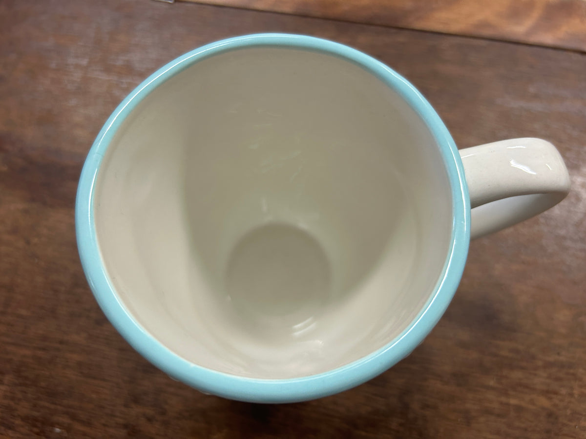 Blue and white Christmas mug interior with rounded rim and side handle