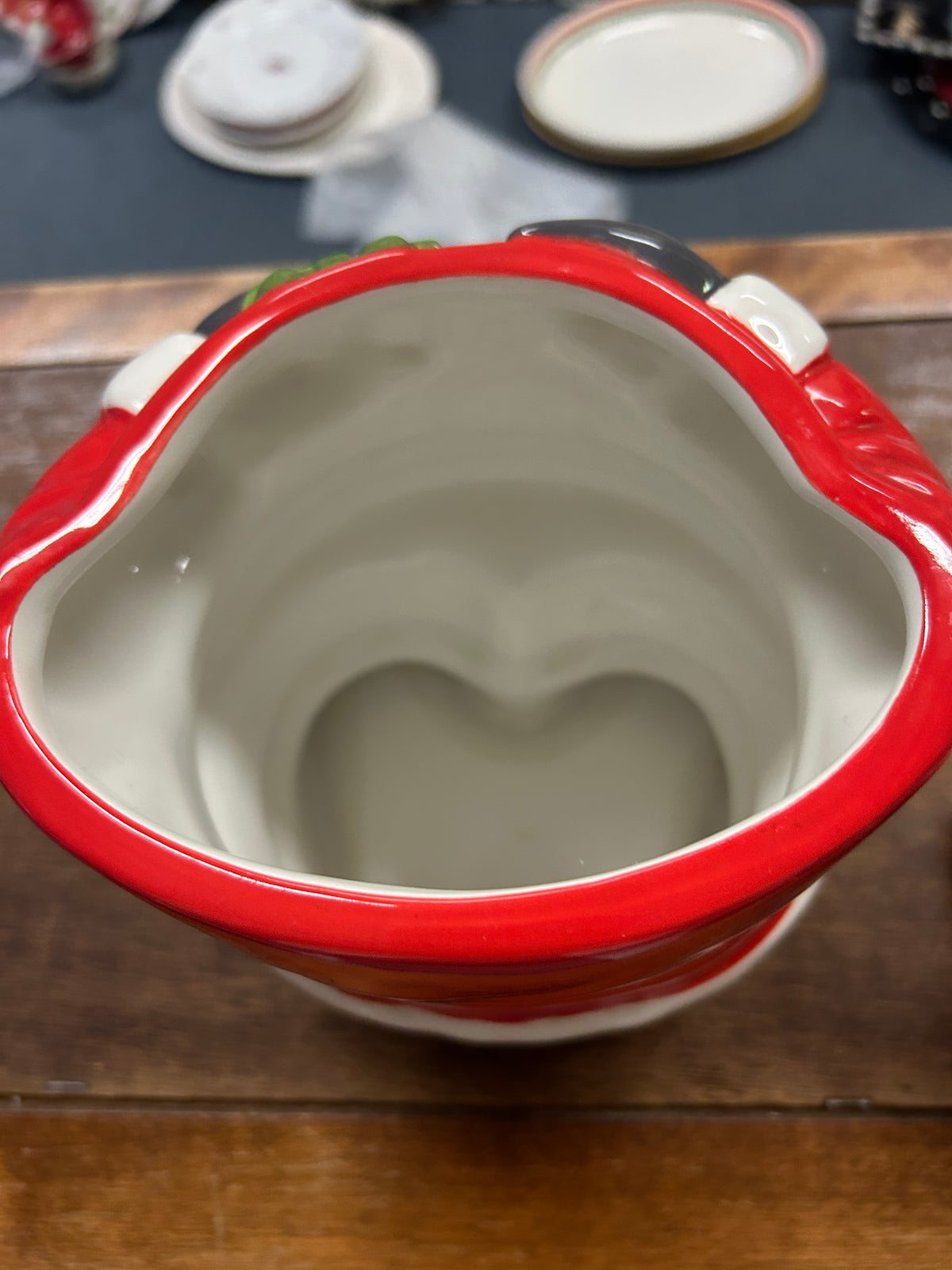 Santa cookie jar interior view, red rim and white ceramic opening
