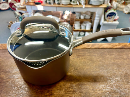 Circulon champagne 2 qt sauce pan, lid on with handle and pouring rim