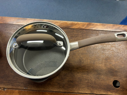 Circulon sauce pan with lid, interior view and circular brushed base