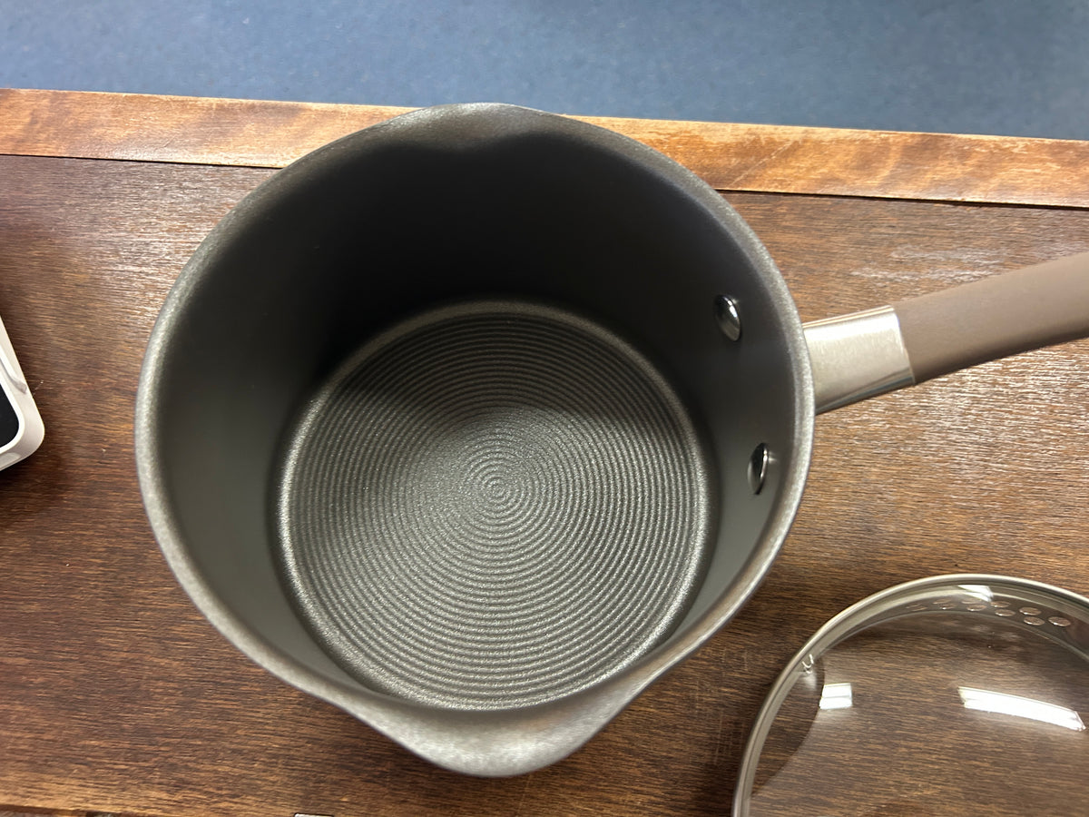 Circulon champagne 2 qt sauce pan, top-down view of nonstick base texture