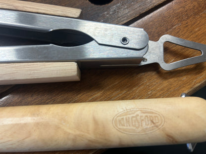 Metal spring tongs with wooden handle and hanging hole