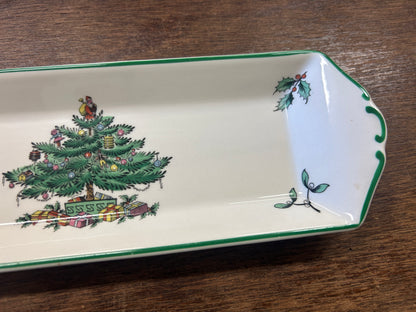 White porcelain Christmas tree platter with green border and painted tree scene, corner view