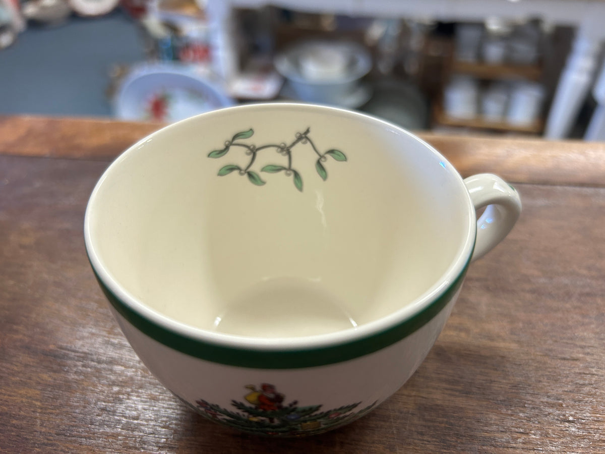 Ceramic Christmas cup top view with green rim and small holly sprig detail