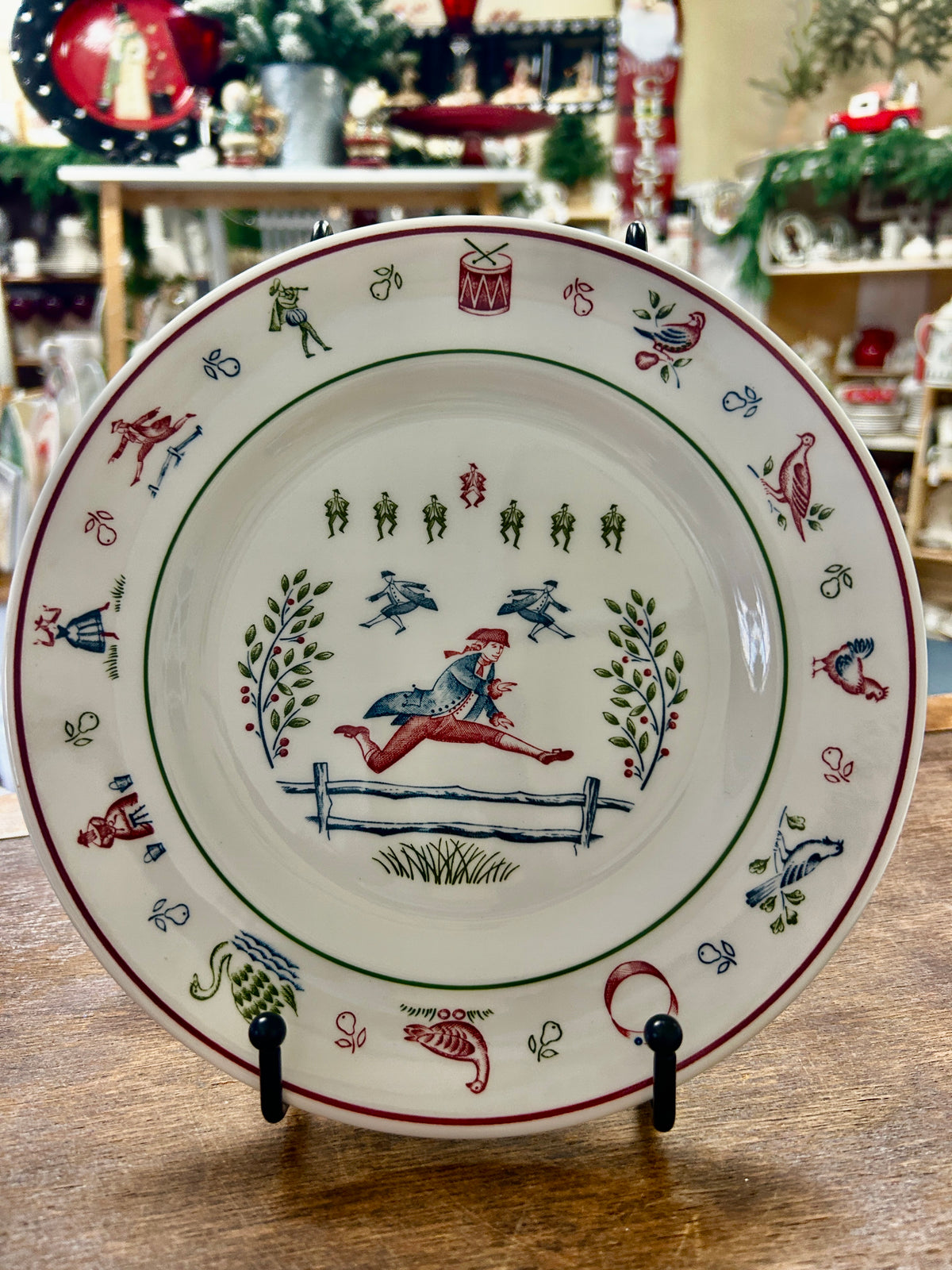 Multicolor Johnson Bros Christmas plate with horse rider center and decorative border