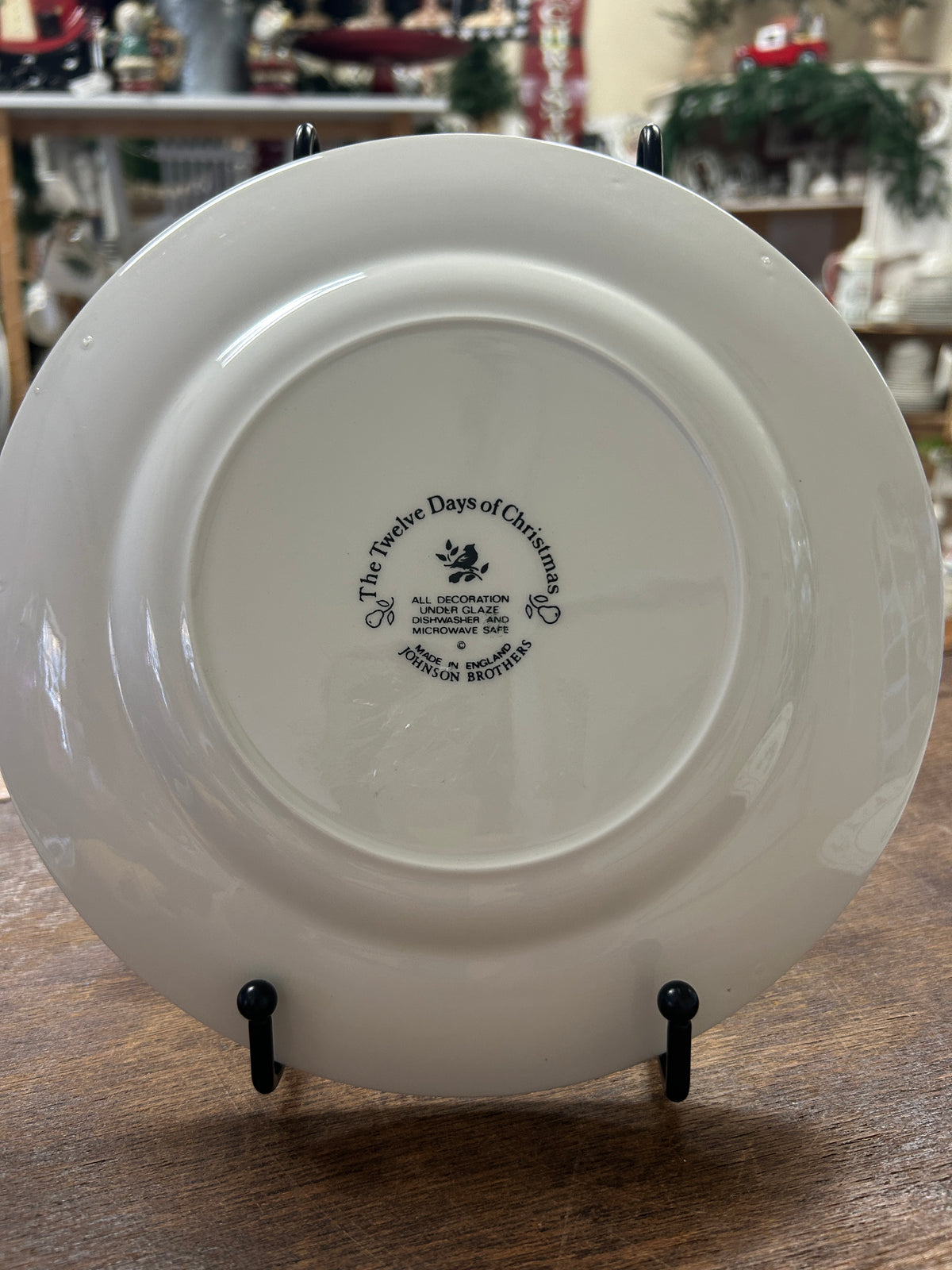 White ceramic Christmas plate back with Johnson Bros markings and text.