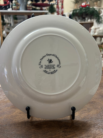 White ceramic Christmas plate back with Johnson Bros markings and text.