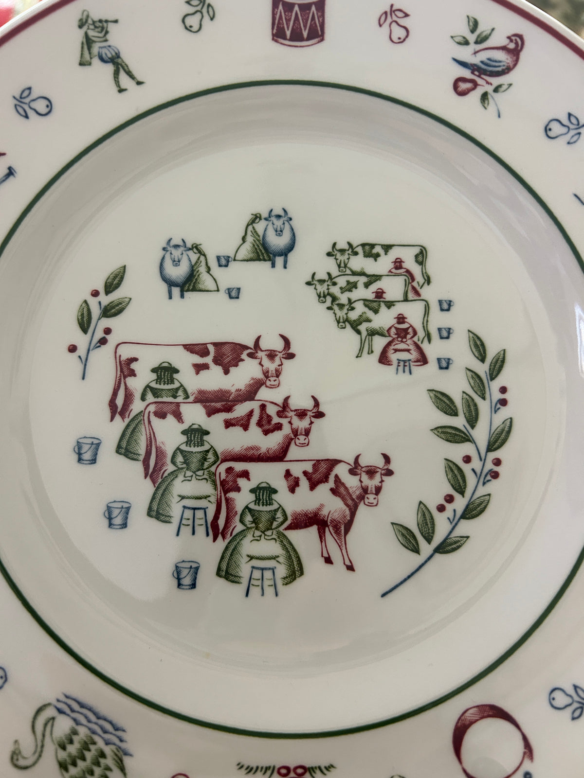 Decorative Christmas plate with multicolor farm-animal and greenery illustration, wide rim